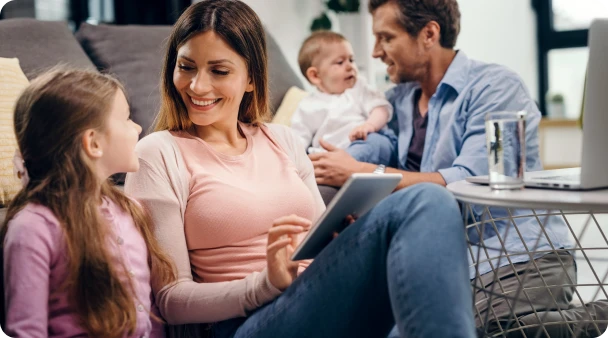 mother and daughter sitting on couch