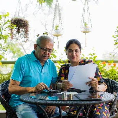 old couple reading documents