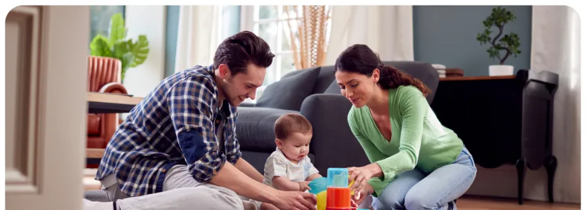 Happy Parents playing with their toddler